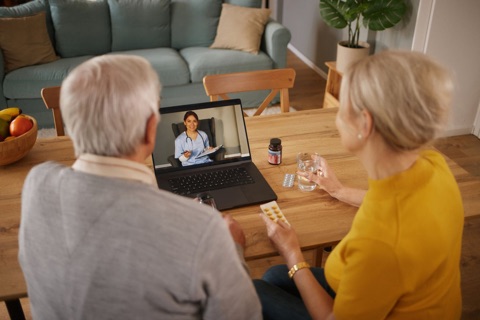 Couple starting an online visit at home